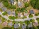 An aerial view showcases this home and neighborhood, complete with tree-lined streets at 300 Brackin Trce, Grayson, GA 30017
