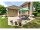 This home's back patio includes a seating area, potted plants, and a view of the house's exterior at 300 Brackin Trce, Grayson, GA 30017