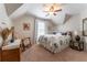 Bedroom featuring a bed with floral bedding, complemented by a window and traditional furnishings at 300 Brackin Trce, Grayson, GA 30017