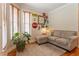 Cozy living room with a grey couch, wood floors and vintage Coca-Cola decor at 300 Brackin Trce, Grayson, GA 30017