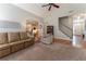 Open-concept living room with views of the kitchen, foyer, and staircase at 300 Brackin Trce, Grayson, GA 30017
