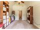 Large walk-in closet featuring built-in shelves, hanging racks, and a carpeted floor at 300 Brackin Trce, Grayson, GA 30017
