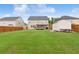 A spacious, lush backyard with a deck, shed, and wooden fence offering privacy and space at 3303 Hawthorn Farm Blvd, Loganville, GA 30052