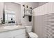 Bathroom features a modern sink, open shelving, and a black and white striped shower curtain at 3303 Hawthorn Farm Blvd, Loganville, GA 30052
