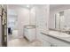 Bright bathroom featuring dual sinks and access to another room at 3303 Hawthorn Farm Blvd, Loganville, GA 30052