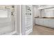 Modern bathroom featuring a glass shower, storage, double sinks, and vanity at 3303 Hawthorn Farm Blvd, Loganville, GA 30052