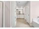 Bright bathroom featuring walk-in closet, double doors, dual sinks, and vanity at 3303 Hawthorn Farm Blvd, Loganville, GA 30052