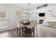 Dining area with modern lighting, access to the backyard, open layout to the living area at 3303 Hawthorn Farm Blvd, Loganville, GA 30052