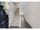 Inviting entryway with hardwood floors, staircase, and bright natural light at 3303 Hawthorn Farm Blvd, Loganville, GA 30052