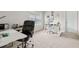 Bright and spacious home office features a large window and glass top work desk at 3303 Hawthorn Farm Blvd, Loganville, GA 30052