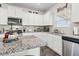 Updated kitchen featuring granite countertops, stainless appliances and lots of storage space at 3303 Hawthorn Farm Blvd, Loganville, GA 30052