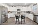 Modern kitchen with stainless steel appliances, granite countertops, and central island with seating at 3303 Hawthorn Farm Blvd, Loganville, GA 30052