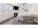 Bright living room features a fireplace, ceiling fan, modern decor, and lots of natural light at 3303 Hawthorn Farm Blvd, Loganville, GA 30052