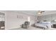 Large main bedroom with plush carpet, tray ceilings, and a seating area at 3303 Hawthorn Farm Blvd, Loganville, GA 30052
