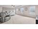 The spacious main bedroom is bright and has tray ceilings, plush carpeting, and ample natural light at 3303 Hawthorn Farm Blvd, Loganville, GA 30052