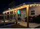 Nighttime patio with decorative lighting and outdoor seating, ideal for relaxing at 3303 Hawthorn Farm Blvd, Loganville, GA 30052