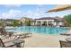 Community pool with chairs and splash fountain provides a fun recreation space for families and residents at 3303 Hawthorn Farm Blvd, Loganville, GA 30052