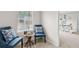 Sitting room with two chairs and a view into the office space at 3303 Hawthorn Farm Blvd, Loganville, GA 30052