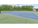 A well-maintained tennis court surrounded by lush greenery, perfect for sports and recreation at 3303 Hawthorn Farm Blvd, Loganville, GA 30052