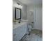 Bathroom with a dual-sink vanity, modern fixtures, and updated flooring for a clean and fresh aesthetic at 6985 Shane Ln, Cumming, GA 30028