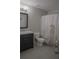 Charming bathroom featuring a shower, vanity, toilet, and a unique seahorse-themed shower curtain at 6985 Shane Ln, Cumming, GA 30028