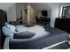 Spacious bedroom with a desk, chair, storage, TV, and a comfortable bed with a soccer design at 6985 Shane Ln, Cumming, GA 30028