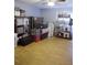 Room with hard wood flooring filled with storage containers and bed frames at 6985 Shane Ln, Cumming, GA 30028