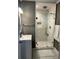 Bathroom view featuring a modern shower, stylish vanity and wainscotting at 996 Palmetto Sw Ave, Atlanta, GA 30314