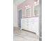 Bathroom with marble floors, pink walls, and a double sink and shower at 996 Palmetto Sw Ave, Atlanta, GA 30314