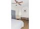 Bedroom with hardwood floors, a bed, a sitting chair, and gray closets at 996 Palmetto Sw Ave, Atlanta, GA 30314