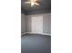 Bedroom featuring neutral walls, carpet, and closet doors at 996 Palmetto Sw Ave, Atlanta, GA 30314