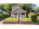 Charming two-story home with landscaped front yard and inviting front porch, perfect for relaxing outdoors at 996 Palmetto Sw Ave, Atlanta, GA 30314