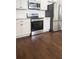 Modern kitchen with stainless steel appliances, granite countertops, and white cabinetry at 996 Palmetto Sw Ave, Atlanta, GA 30314