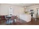 Bright eat-in kitchen features a central island, stainless steel appliances and stylish pendant lighting at 996 Palmetto Sw Ave, Atlanta, GA 30314