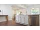 Stylish kitchen island with stainless steel dishwasher and white cabinetry in an open concept layout at 996 Palmetto Sw Ave, Atlanta, GA 30314
