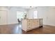 Charming kitchen island with white cabinetry and stainless steel dishwasher in a bright space at 996 Palmetto Sw Ave, Atlanta, GA 30314