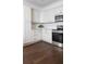 Bright kitchen featuring white cabinets, stainless steel appliances, and modern backsplash at 996 Palmetto Sw Ave, Atlanta, GA 30314