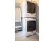 Modern laundry room with stacked washer and dryer at 996 Palmetto Sw Ave, Atlanta, GA 30314