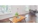 Bright living room with hardwood floors, white walls, and large windows for natural light at 996 Palmetto Sw Ave, Atlanta, GA 30314
