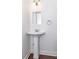 Bright powder room featuring pedestal sink, mirror, and modern fixtures at 996 Palmetto Sw Ave, Atlanta, GA 30314