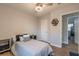 Well-lit bedroom with wood flooring, ceiling fan, and modern furnishings at 2089 Quilt Ct, Lithonia, GA 30058