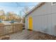 Exterior of home with a back deck and a yellow door at 2089 Quilt Ct, Lithonia, GA 30058