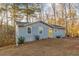 Exterior of home features a large yard and a yellow door at 2089 Quilt Ct, Lithonia, GA 30058