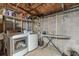 Laundry room includes a washer, dryer, and ironing board at 2089 Quilt Ct, Lithonia, GA 30058