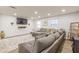 Inviting living room with plush sectional sofa, decorative rug, and plenty of natural light at 2089 Quilt Ct, Lithonia, GA 30058