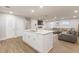 Open-concept living space with a large kitchen island and a comfortable sectional sofa at 2089 Quilt Ct, Lithonia, GA 30058