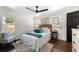 Sunlit bedroom with hardwood floors, a ceiling fan, and windows offering natural light at 2277 Cloverdale Se Dr, Atlanta, GA 30316