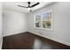 Well-lit bedroom featuring hardwood floors, white walls, and a window view of the outdoors at 2277 Cloverdale Se Dr, Atlanta, GA 30316