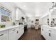 Bright kitchen with white cabinets, stainless steel appliances, and view to the living room at 2277 Cloverdale Se Dr, Atlanta, GA 30316