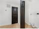 Bright laundry room with wooden floors features a dark door with three panels to blend seamlessly with any decor at 2277 Cloverdale Se Dr, Atlanta, GA 30316
